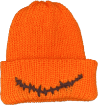 a knitted orange beanie with a skeleton face on it