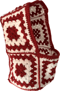 a red and white crocheted headband